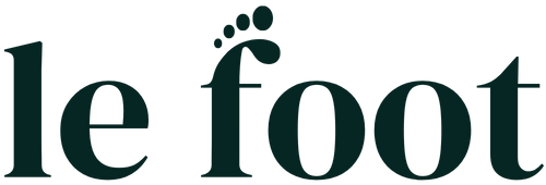 “le foot” wordmark logo in dark green with a tiny footprint accent over the “f.”