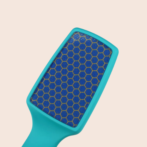 teal nano-glass foot file showcasing its fine abrasive surface on a light background.